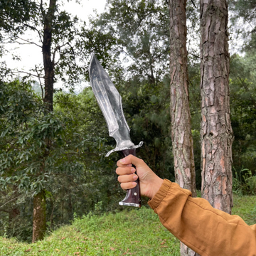 Man holding Rosewood handle of Tikau Kukri knife with full tang construction for secure grip